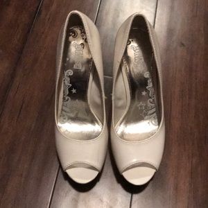 White platform open toe heels.